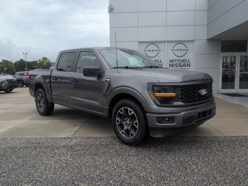 2024 Ford F-150 STX in Carbonized Gray Metallic — front three-quarter view