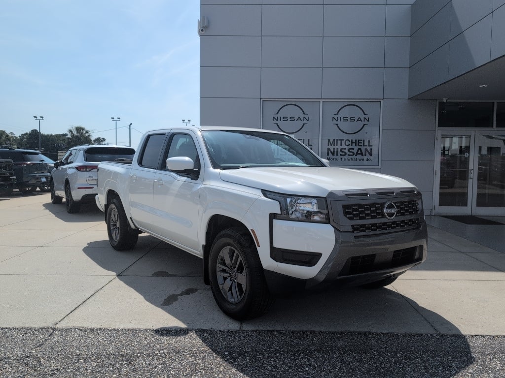 2025 Nissan Frontier Crew Cab SV in Glacier White — front three-quarter view