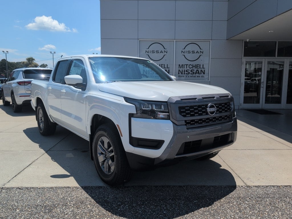 2026 Nissan Frontier Crew Cab SV in Glacier White — front three-quarter view