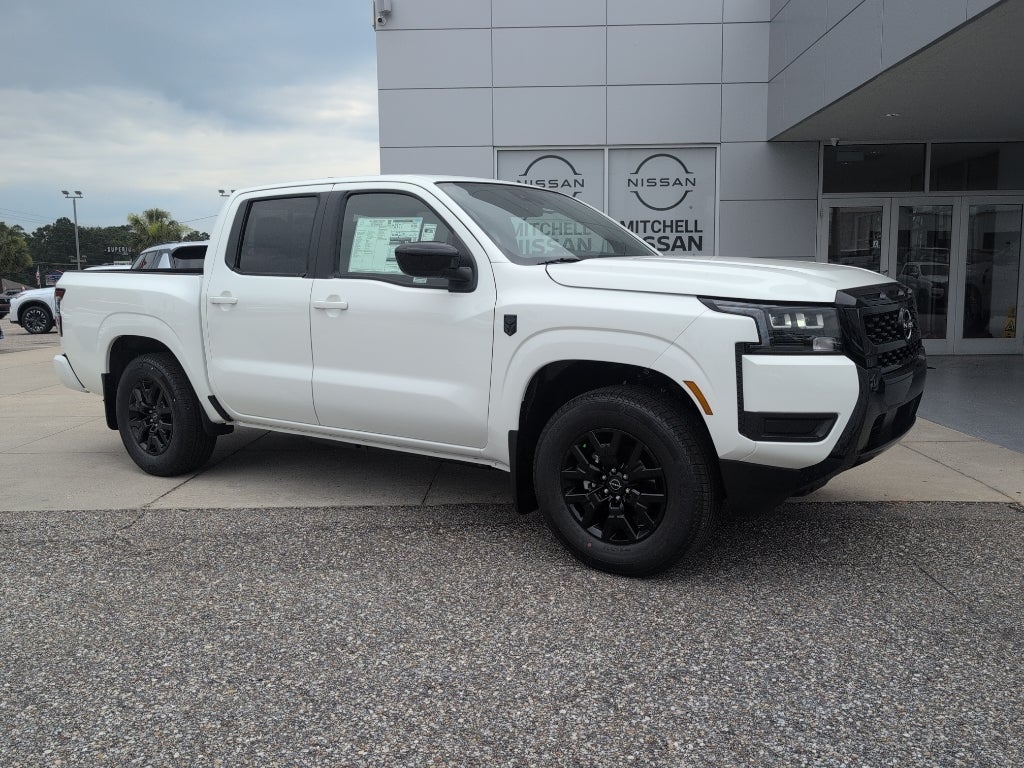 2026 Nissan Frontier Crew Cab SV in Glacier White — front three-quarter view