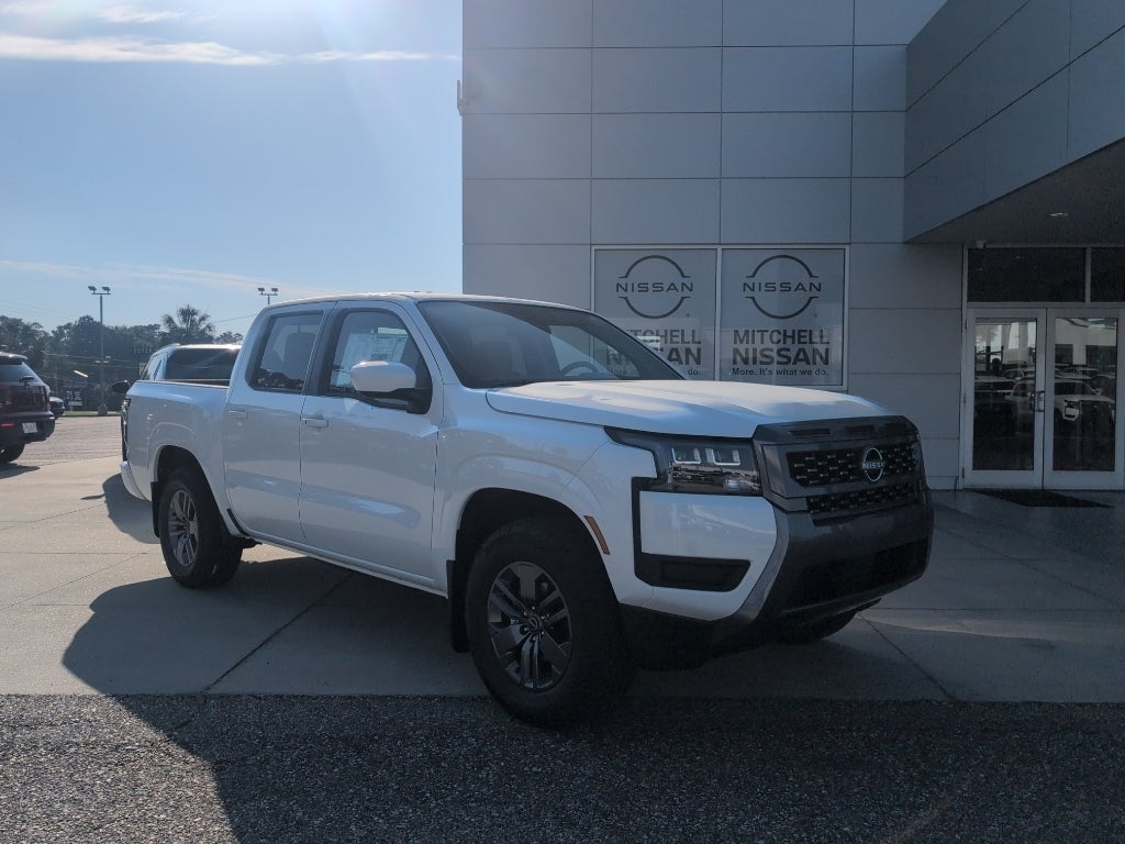 2026 Nissan Frontier Crew Cab SV in Glacier White — front three-quarter view