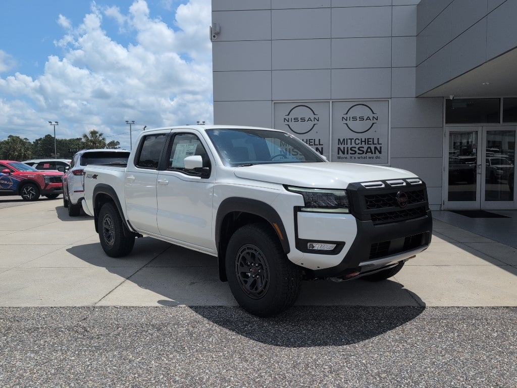2026 Nissan Frontier Crew Cab PRO-4X in Glacier White — front three-quarter view