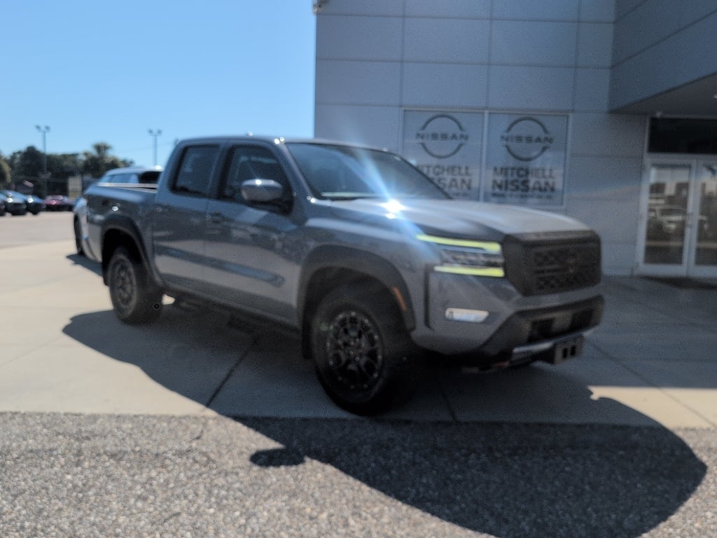 2022 Nissan Frontier Crew Cab PRO-4X in Boulder Grey Pearl — front three-quarter view