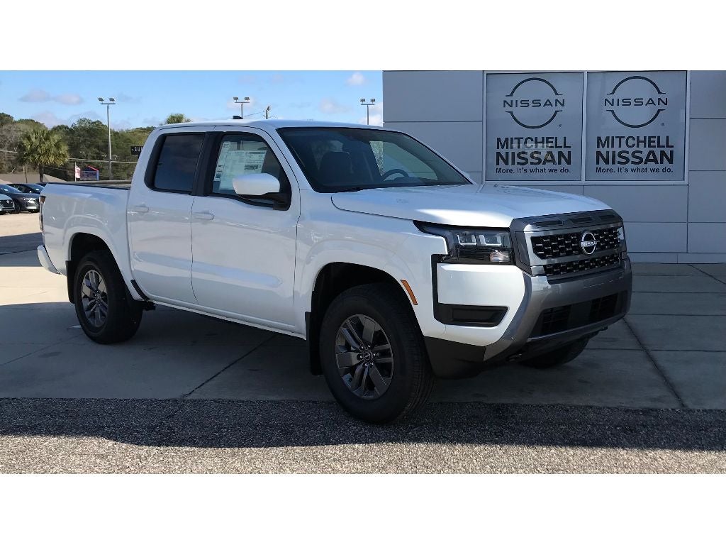 2026 Nissan Frontier Crew Cab SV in Glacier White — front three-quarter view