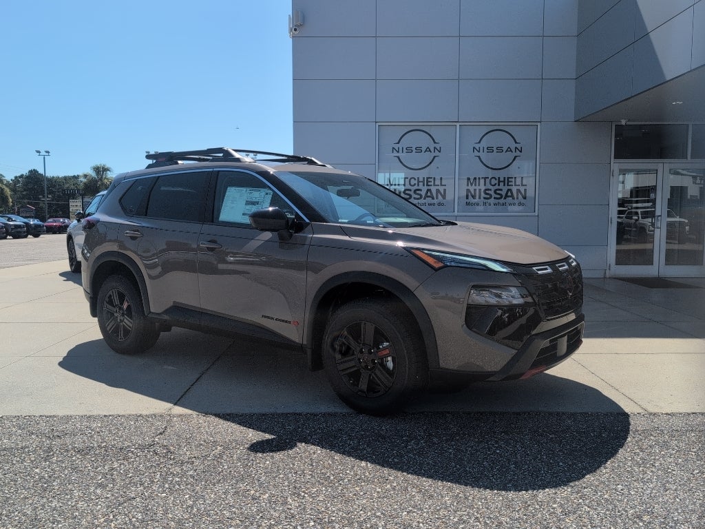 2026 Nissan Rogue Rock Creek in Baja Storm Metallic — front three-quarter view