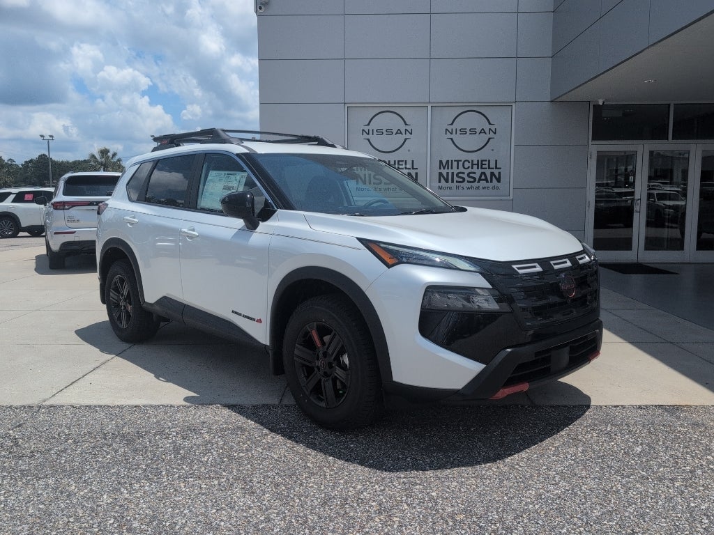 2026 Nissan Rogue Rock Creek in Everest White Pearl Tricoat — front three-quarter view